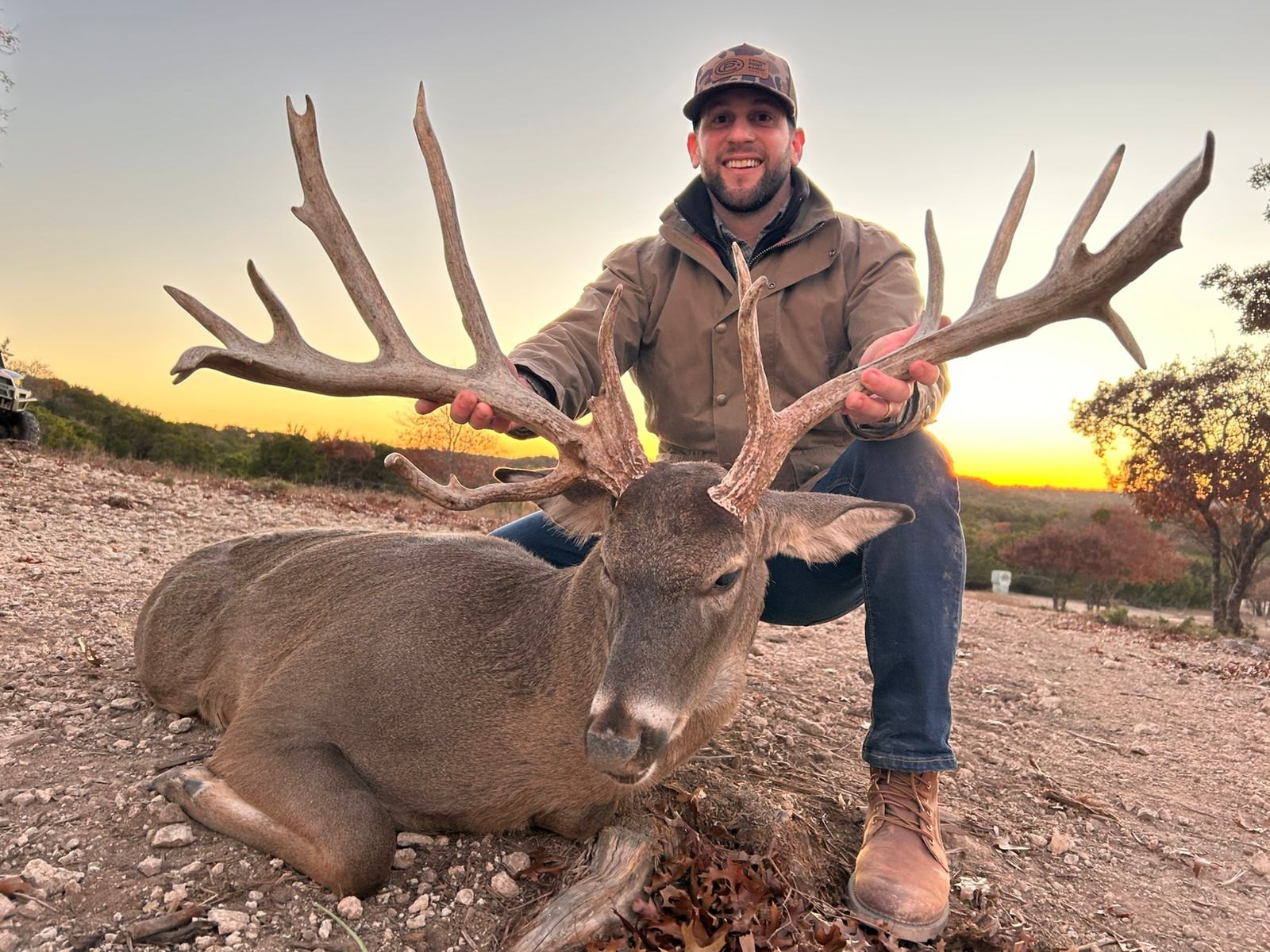 Tall wide typical whitetail buck harvested at last light at Crown Point Ranch, Texas